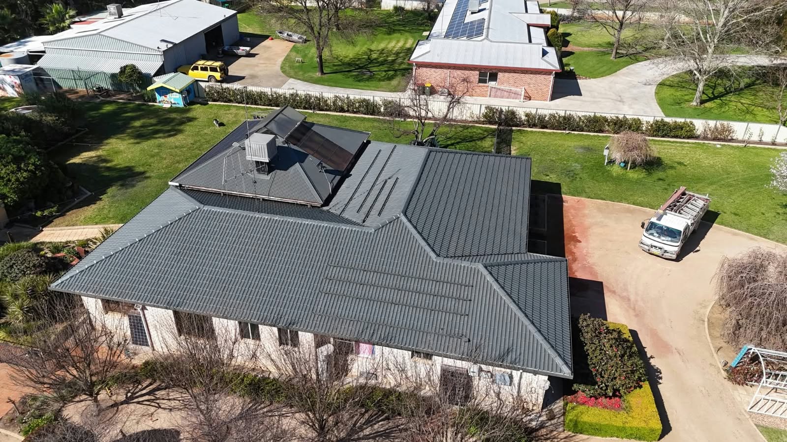 Freshly restored charcoal roof photographed from above